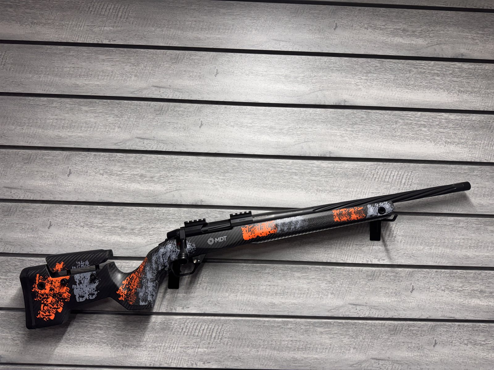 701 Build, MDT stock, black and orange splatter carbon fiber