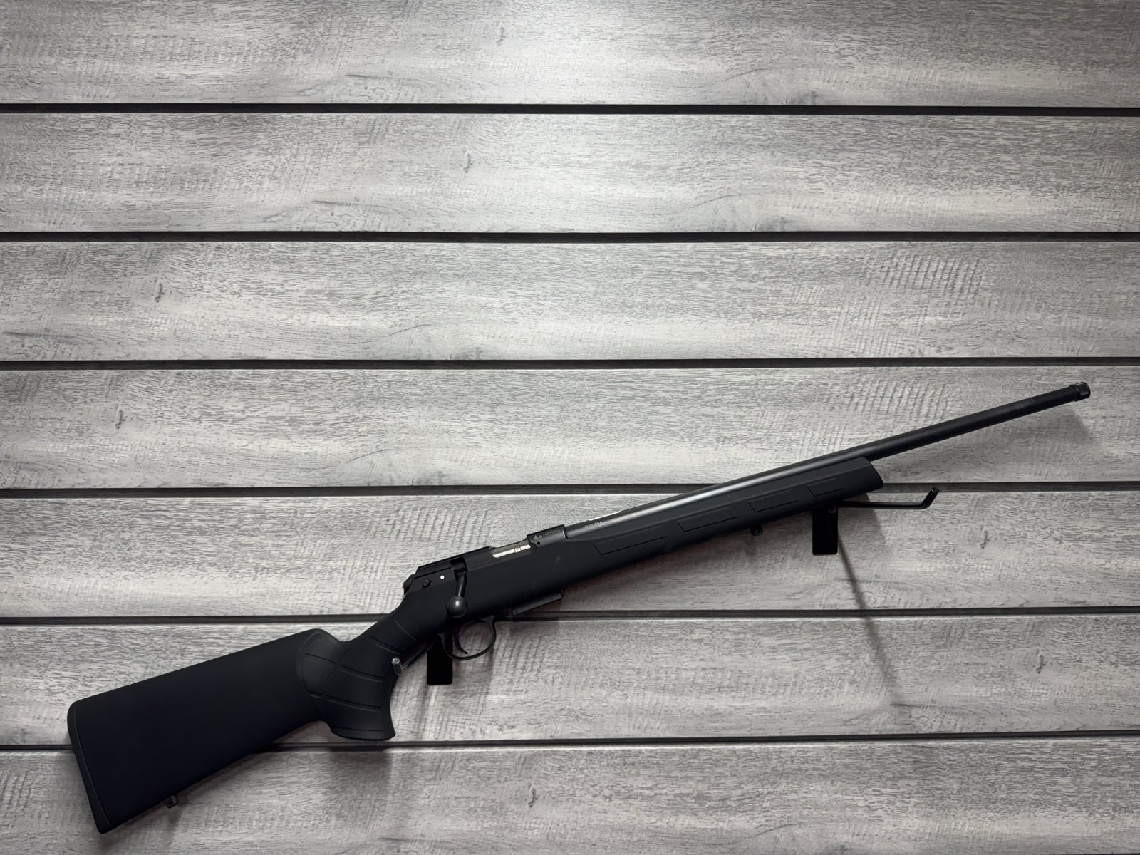 Bolt action rifle, black synthetic stock