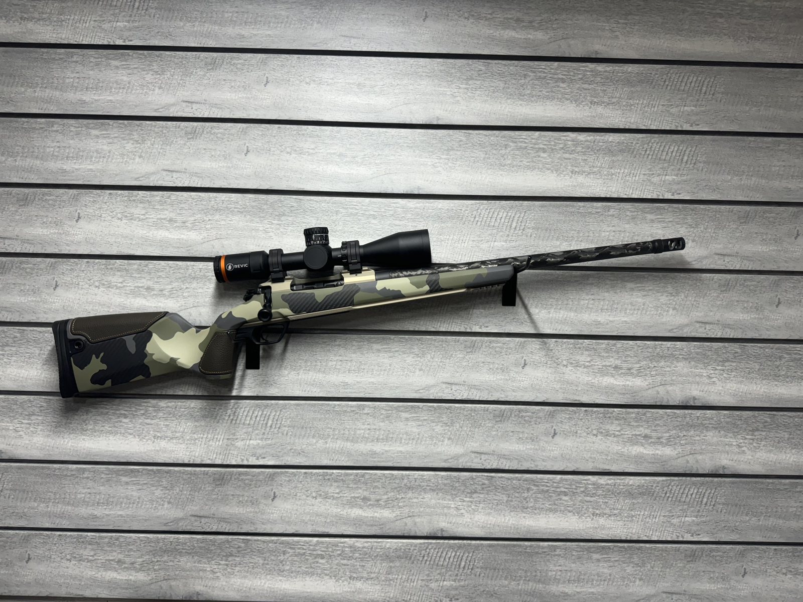 Gunwerks rifle with Revic scope, camo carbon fiber stock