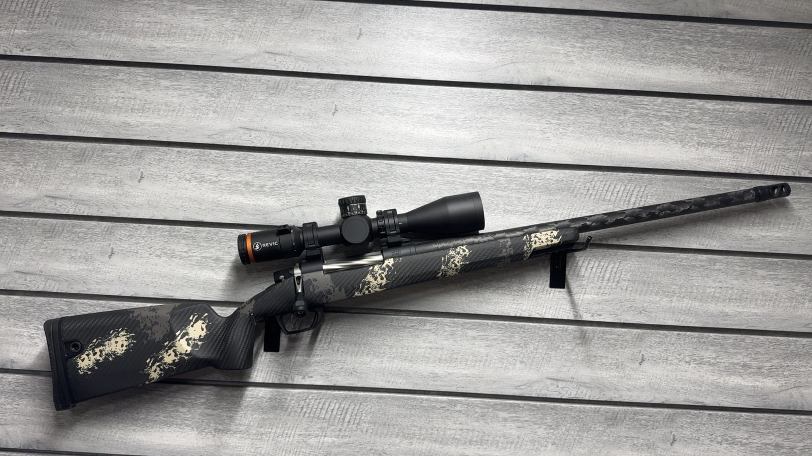 Gunwerks rifle with Revic scope, black and tan carbon fiber stock