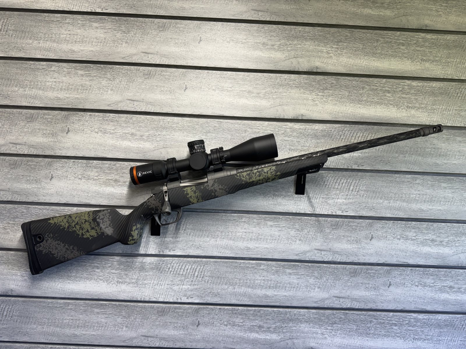 Gunwerks rifle with Revic scope, green camo carbon fiber stock