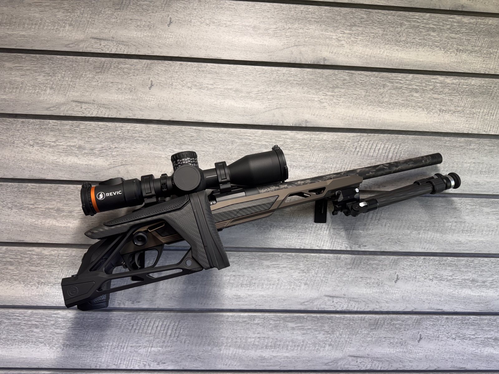 Gunwerks rifle with Revic scope, chassis stock close up