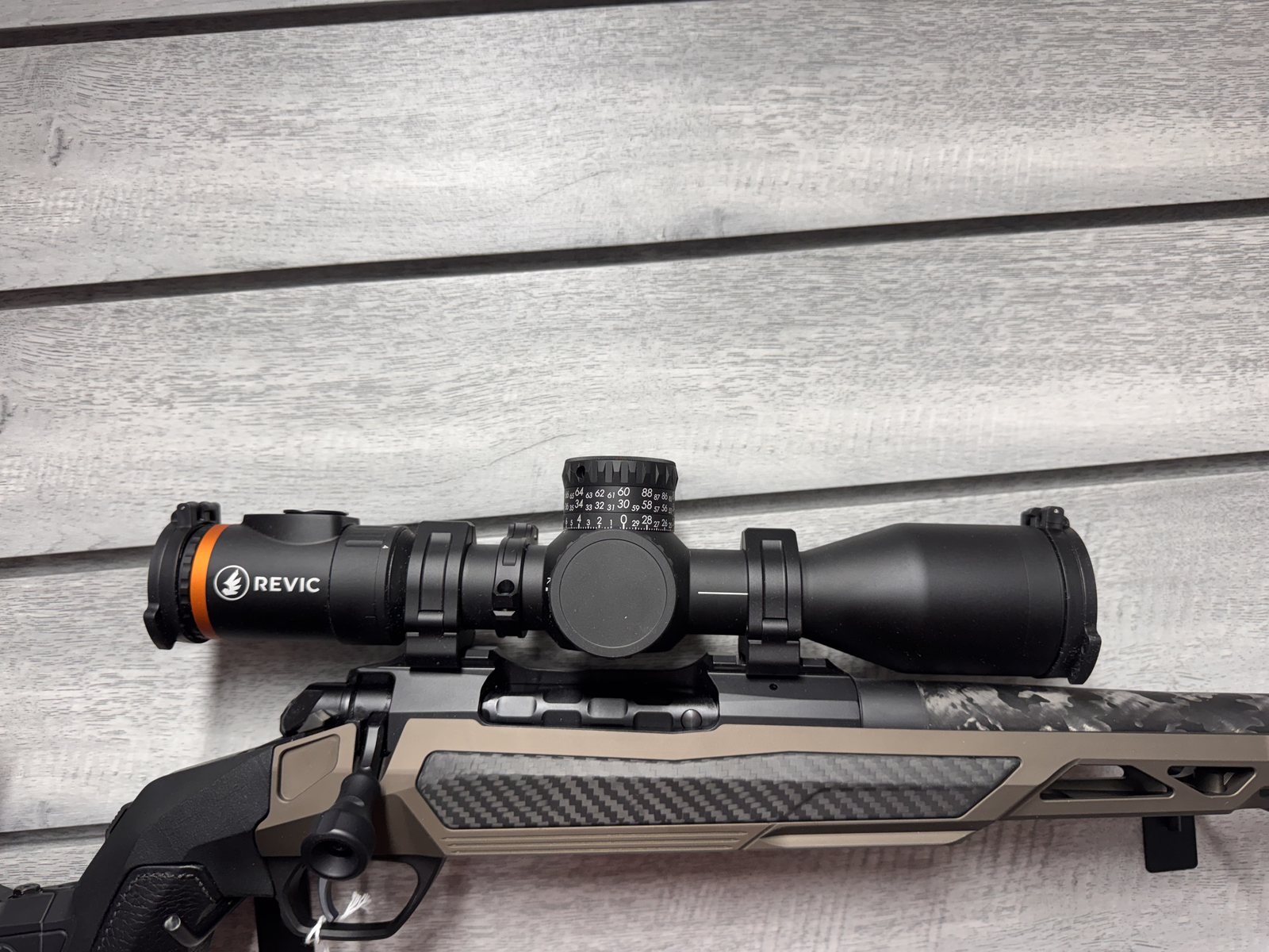 Revic riflescope mounted on rifle, close up of turrets
